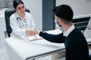 A woman shaking hands with a person