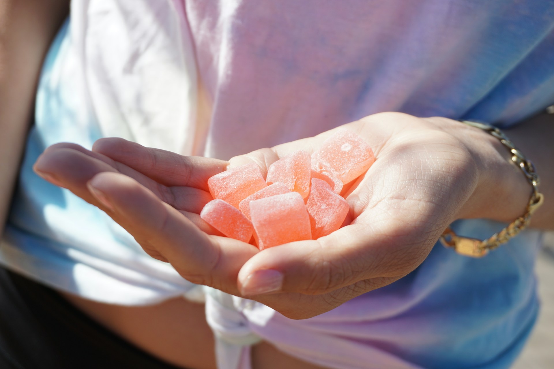 A person holding gummies