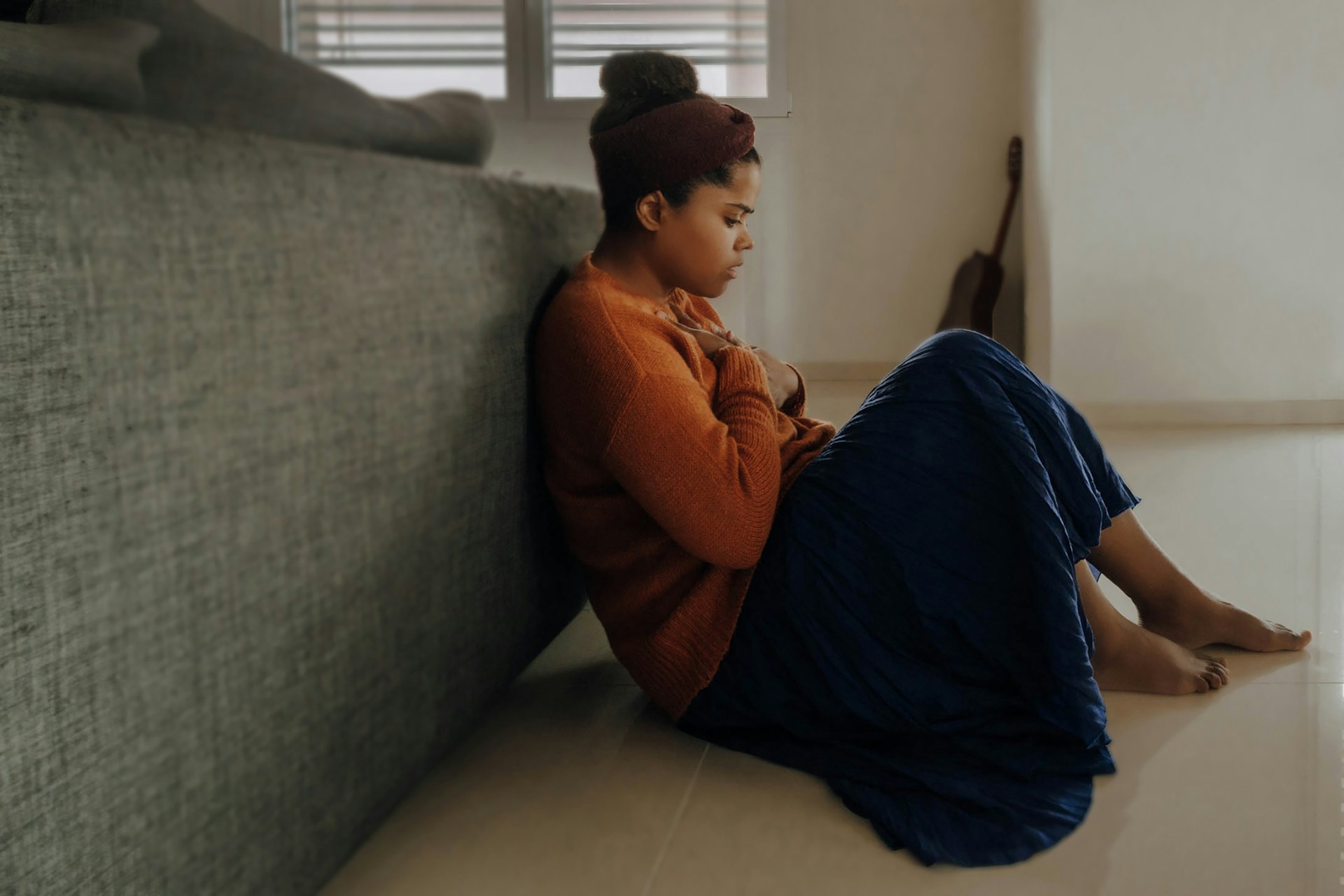 A woman sitting on the floor