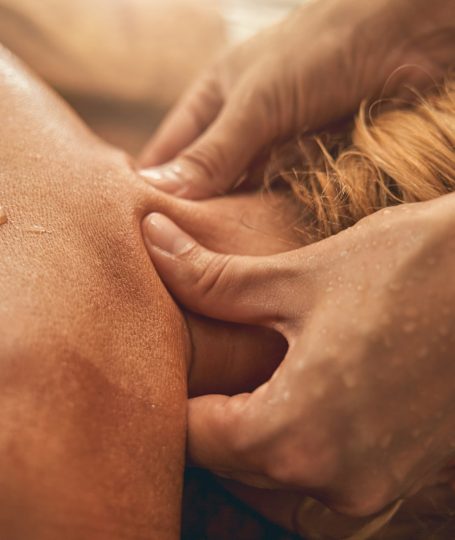 A person being massaged at the nape