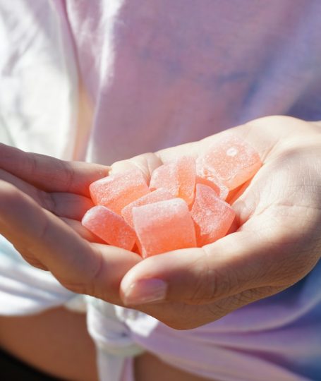 A person holding gummies